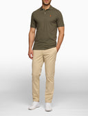Men's plain green cotton polo with multicoloured undercollar