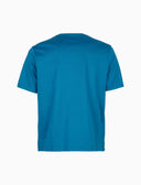 Unisex crew neck T-shirt in solid dyed cotton peacock color.